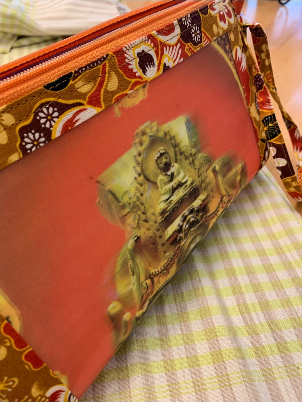 Woman’s Wristlet clutch with Buddha image